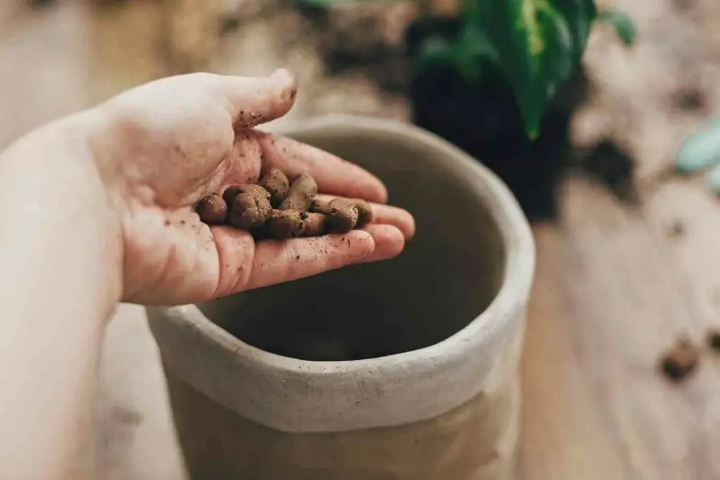 Pebbles instead of drilling holes in planter