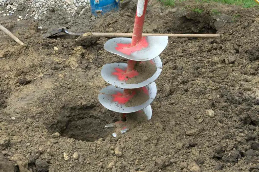 Auger digging backyard